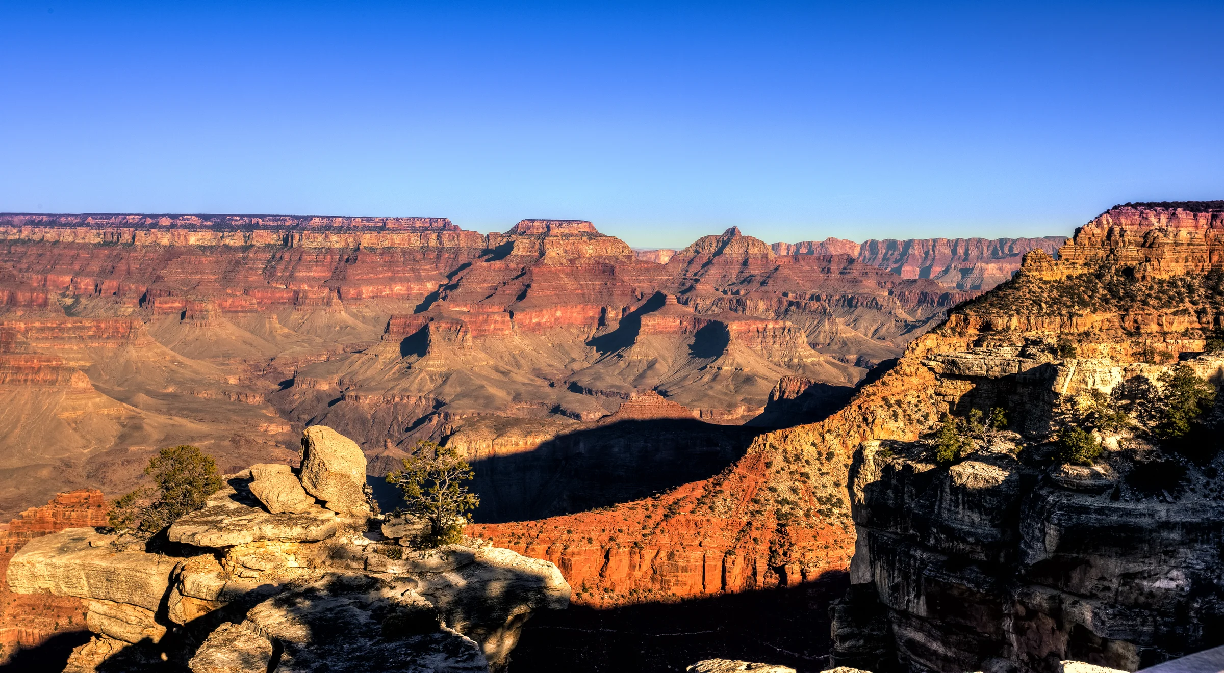 Grand Canyon South Rim canyon view with Colorado River visible far below between layered canyon walls