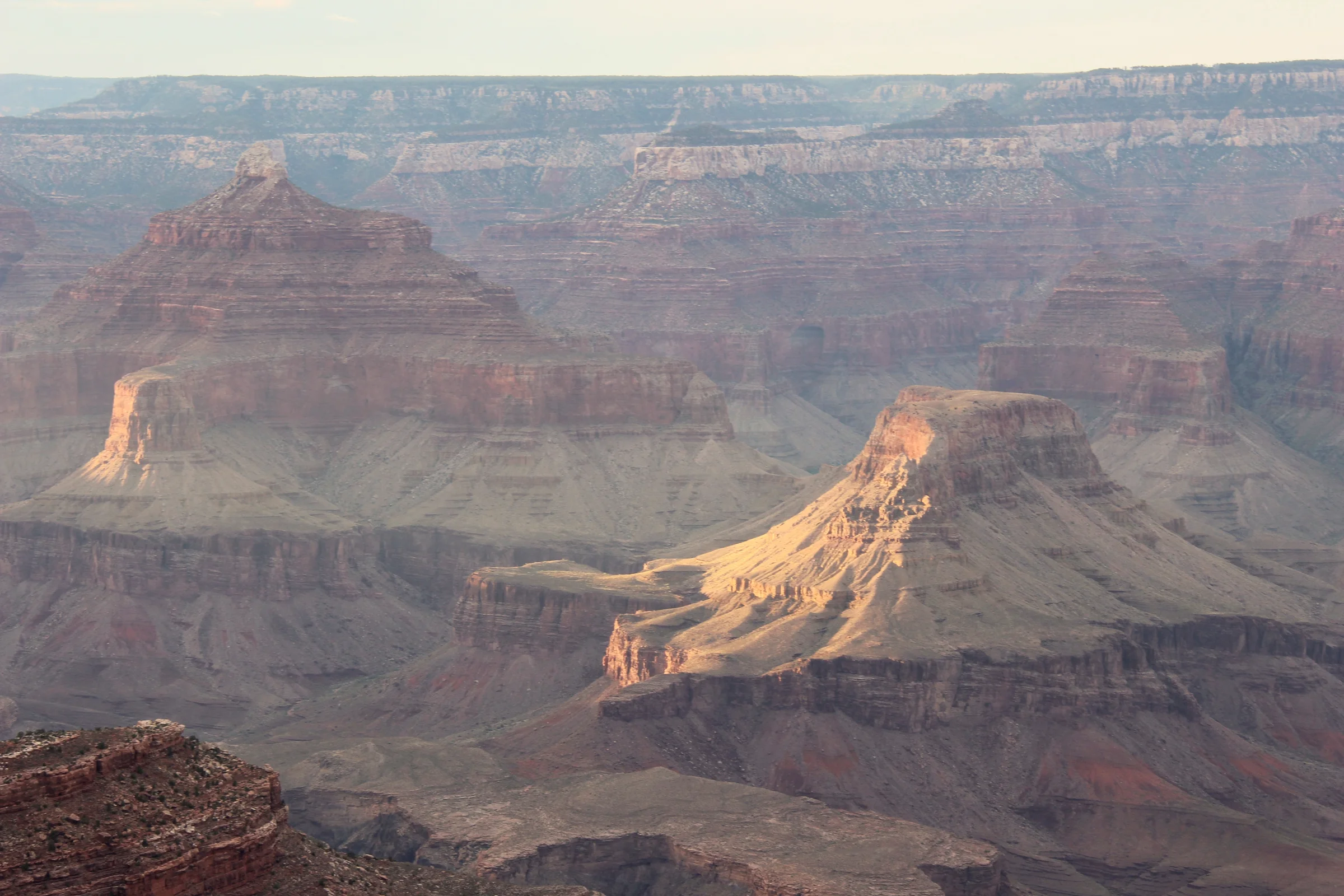 Grand Canyon South Rim layered sandstone buttes and canyon depths viewed from the rim
